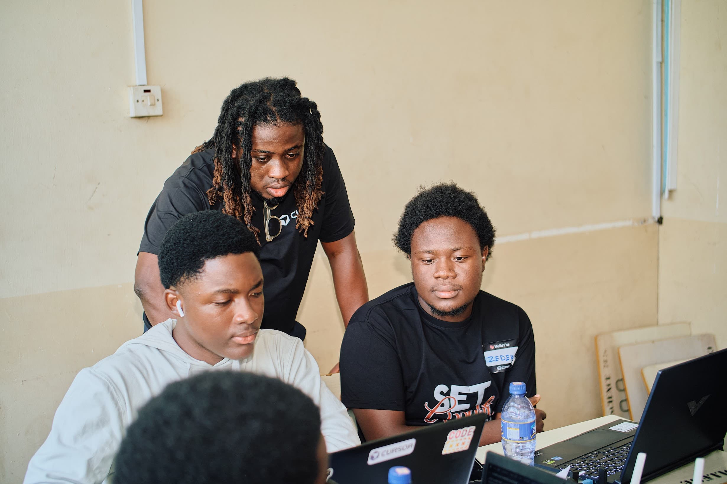 interacting with participants of cursor hackathon knust